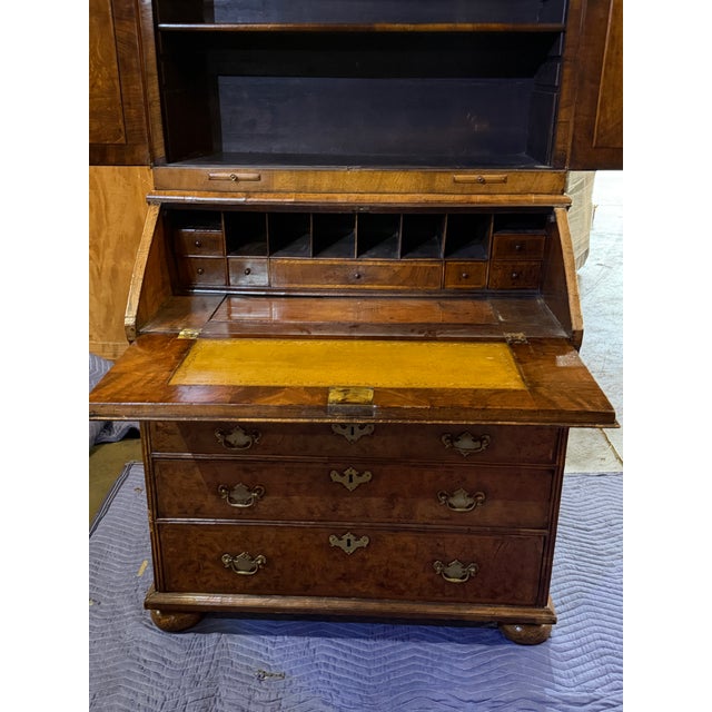 This statement piece is beautifully crafted with highly figured burl walnut veneers, showing off rich grain patterns and...
