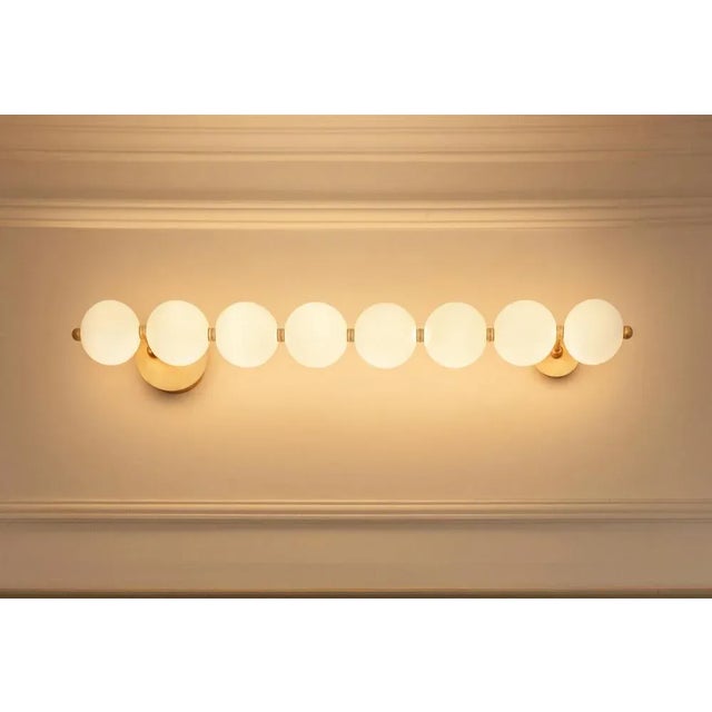 Pearl ligne wall light by ludovic clément d’armont dimensions: d 20 x w 110 x h 12 cm. Materials: blown glass and brass....
