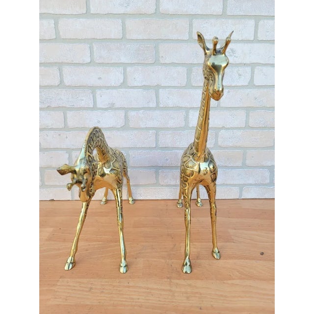 Vintage Brass Giraffe Statues - Set of 2 Measurements Giraffe 1 H 19” W 14” D 4” Giraffe 2 H 13” W 19” D 4”