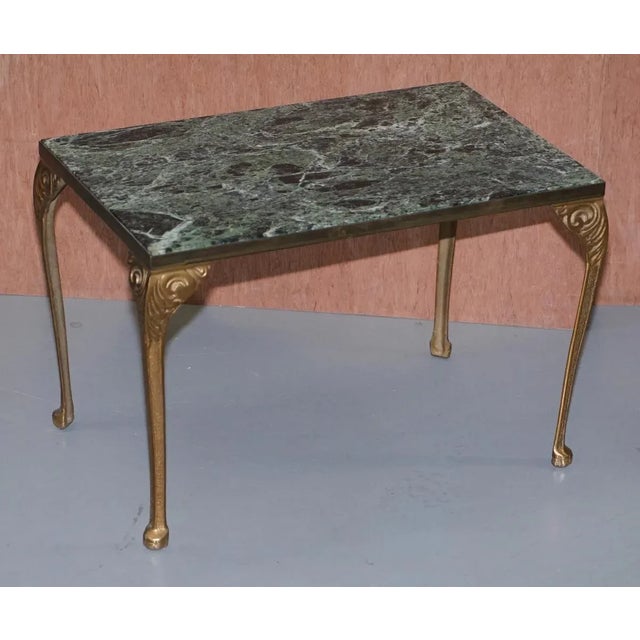 We are delighted to this sublime pair of circa 1900 bronzed frame side tables with thick solid green marble tops These are...