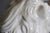 Pair Large White Glazed Ceramic Figures of Entryway Lions Paws Raised on Shield For Sale - Image 10 of 12