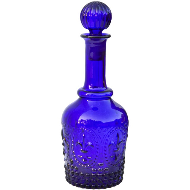 Exquisite, rare and heavy, midcentury art-glass decanter and stopper handblown in cobalt blue. Featuring a remarkable...