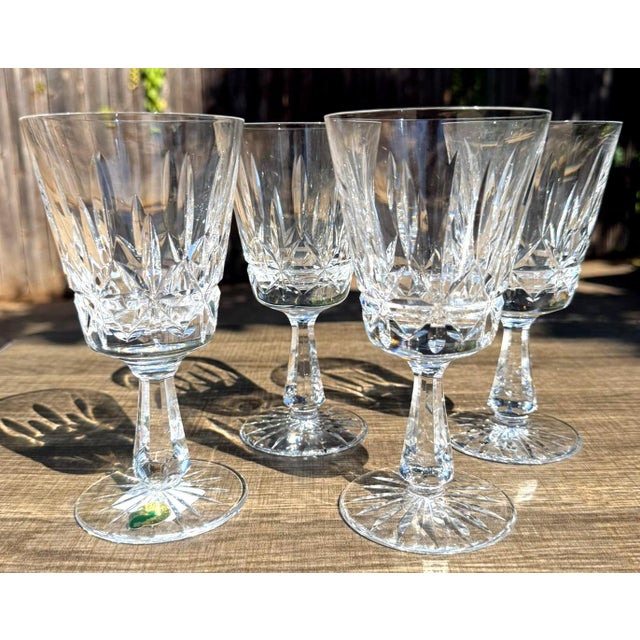 Beautiful set of four authentic Waterford Crystal water goblets in the classic Rosslare pattern. The Rosslare pattern...