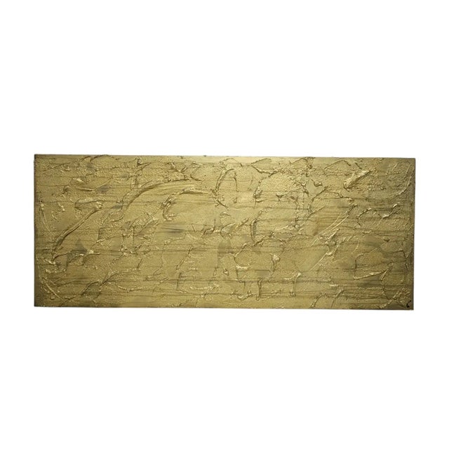 Bold and luxurious, this one-of-a-kind 16” x 39.5” abstract canvas panel painting features a richly layered impasto...