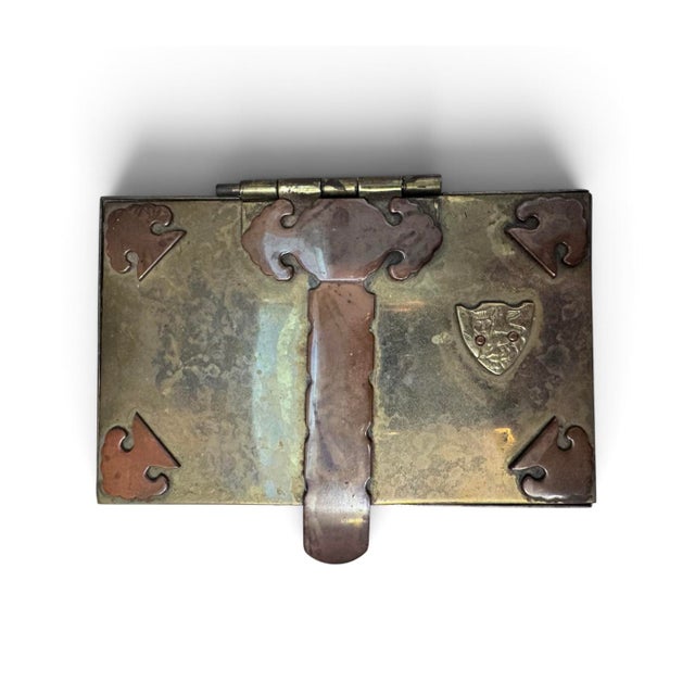 Lion footed box shaped like a trunk, with a crest featuring a lion. Nice weight and classical substantial styling.