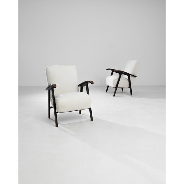 Elevate your home décor with this elegant pair of 1960s Czech Upholstered Armchairs. These vintage treasures feature sleek...