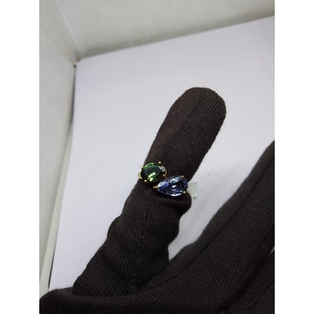 Gemstone details Gold Purity: 18K Solid Gold Tourmaline: 1.15 cts Tanzanite: 2.10 cts 18K gold Gross weight: 3.24 grams...