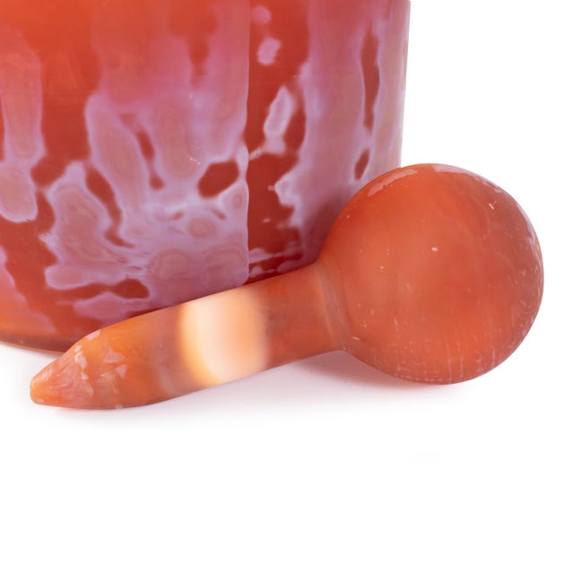 Vases in a vibrant tangerine color, adorned with a matte coating for a textured look. These exquisite vases can be grouped...