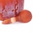 Vases in a vibrant tangerine color, adorned with a matte coating for a textured look. These exquisite vases can be grouped...