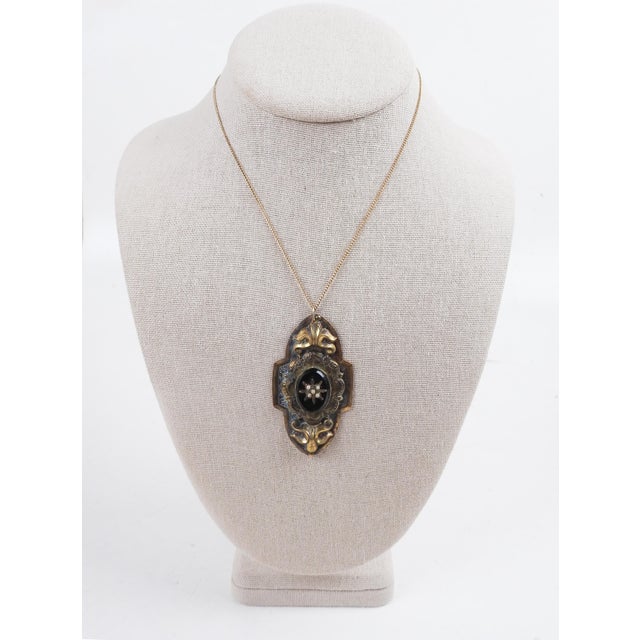 Victorian art nouveau style black onyx, tiny pearls and gilt brass pendant necklace. The antique pendant was convered from...