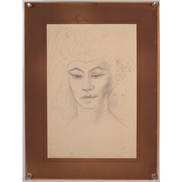 Stylised portrait of a lady with flowers in her hair. Early 20th Century