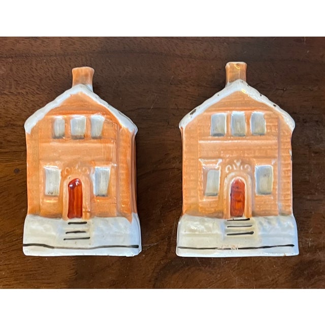Unusual pair of 19th century English Staffordshire red brick cottage banks. Each with a slit on the roof for coins....