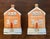 Unusual pair of 19th century English Staffordshire red brick cottage banks. Each with a slit on the roof for coins....