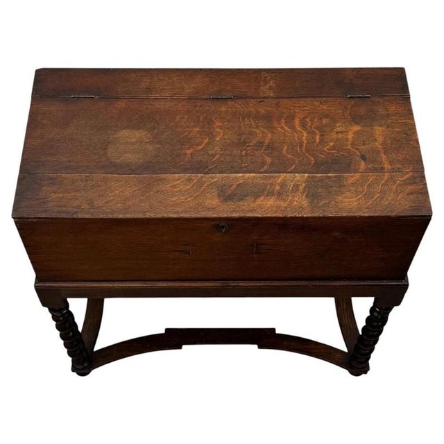 A handsome and highly practical 19th-century English Victorian box on stand, finely constructed in oak and distinguished...
