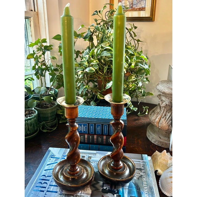 These barley twist candle sticks have some age on them as told by the wonderful patina on the hand turned oak. They...