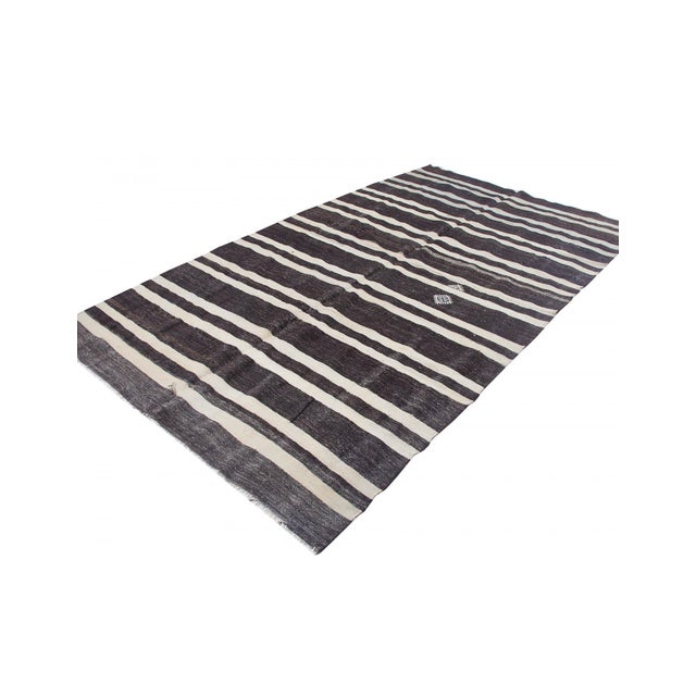 Vintage handwoven decorative kilim rug from Afyon region of Turkey. Approximately 50-60 years old. In very good condition.