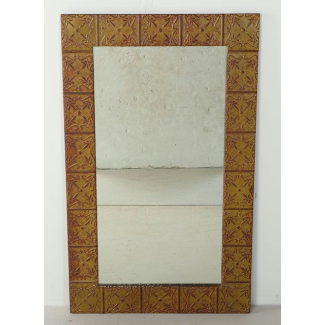A striking fusion of architectural salvage and refined design, this large wall mirror is hand-framed with authentic...