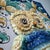 Distinctive hand-painted ceramic wall plaque from caltagirone, sicily, dating from the 1950s-1960s. At its centre is an...