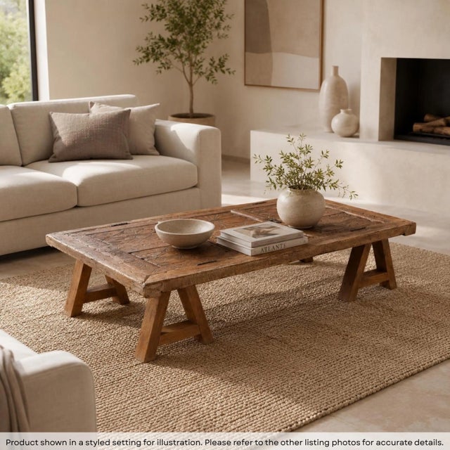 Step into a room anchored by a story. Our Reclaimed Teak Wood Coffee Table is more than just a place to rest your morning...