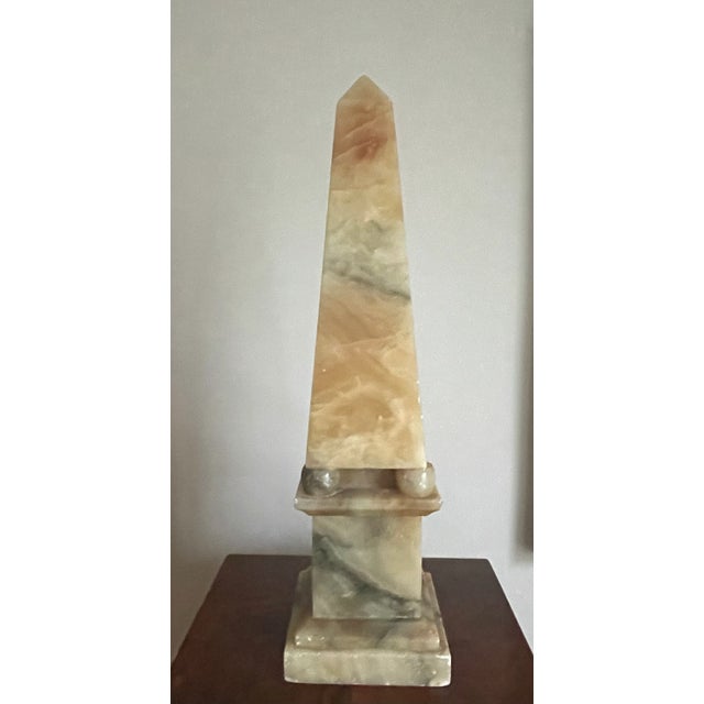 Beautifully detailed alabaster obelisk. Nice veining and coloring works in a variety of interiors.