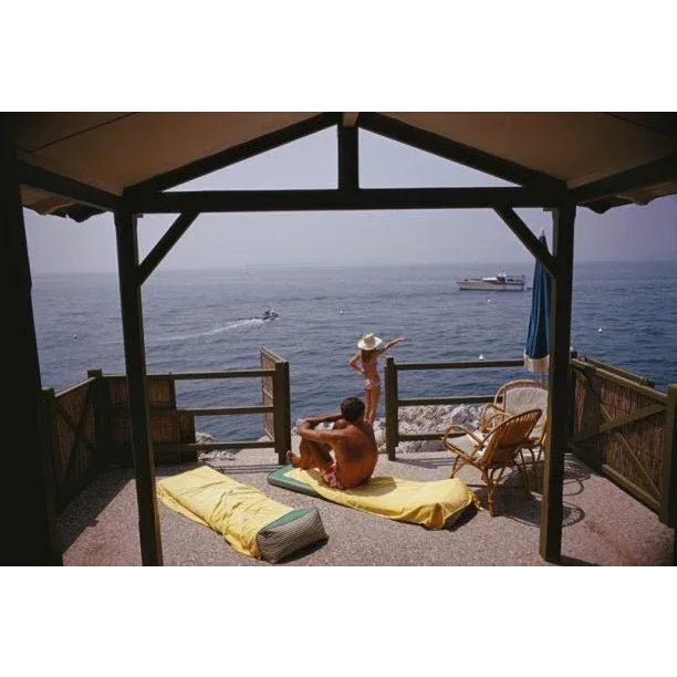 Beach Hut In Antibes 1969 Guests at a beach hut at the Hotel du Cap-Eden-Roc in Antibes on the French Riviera, August...