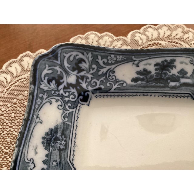 The rare Antique Ford & Sons "Verona" Flow Blue Meat Serving Platter from England is a Victorian-style decorative piece...