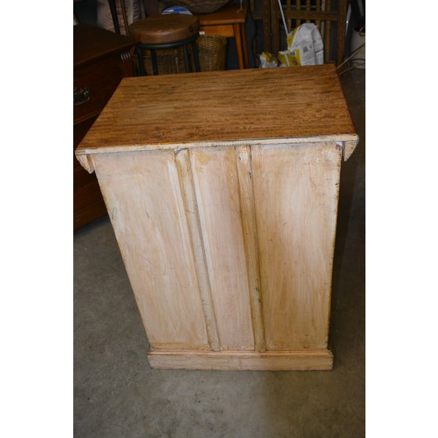 This is a very heavy & solid, rich golden colored, wood cabinet. Not too sure what it was intended for. Many uses for...