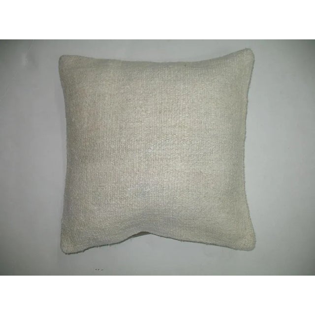 One of a kind Pillow made from a vintage turkish kilim with cotton back. Zipper closure and foam insert provided. 16'' x 16''