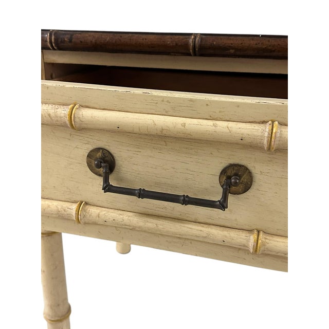 American Thomasville Ivory Faux Bamboo Nightstand This charming night stand has a beautiful faux bamboo frame and dark...