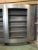 This bookcase is made of galvanized steel. It can be dismantled into two parts and has a lighting system around the...