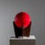 Table lamp on a veneered tripod base with a red spherical lampshade with nickel-plated ring. Attributed to Luciano...