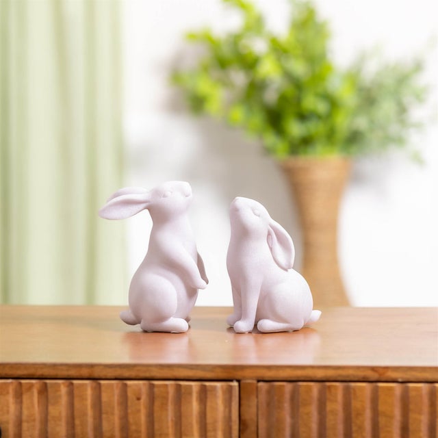 Soft, sweet, and full of springtime charm, this Blush Glitter Bunny figurine set adds a delicate touch to your seasonal...