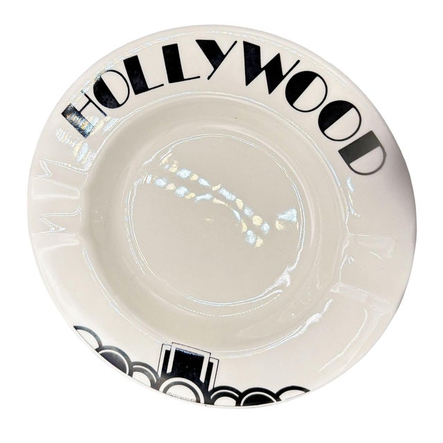 1977 Art Deco style 8” porcelain Hollywood Bowl round ashtray featuring the word "Hollywood" along the rim of the ashtray,...