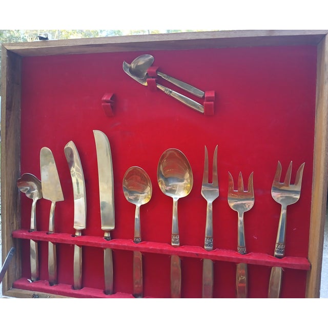 Service for 12 in brass and in the original case (included). Double layer storage. Lovely with simple small detail on...