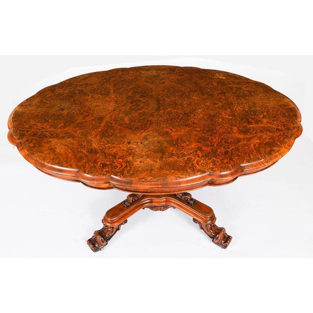 This is a lovely antique Victorian burr walnut tilt top loo table, circa 1860 in date. The shaped oval table top features...