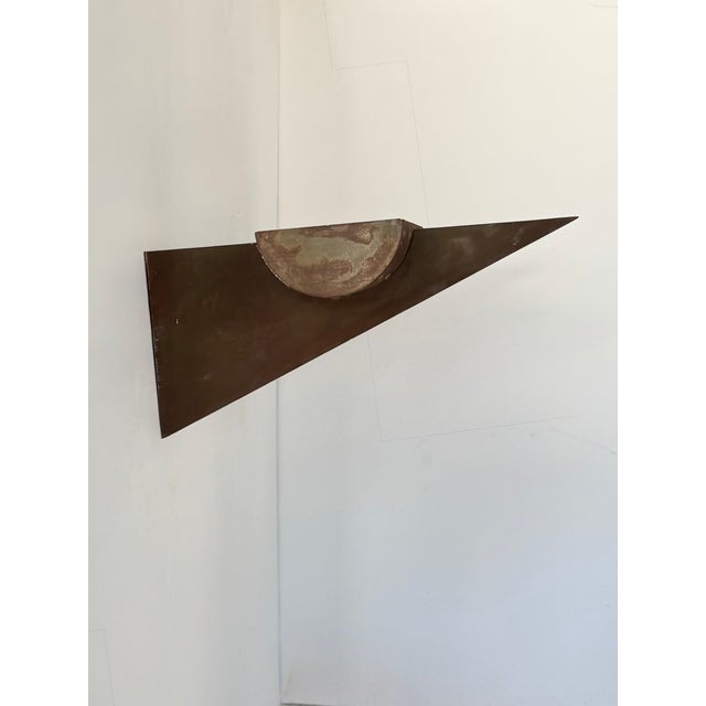 Pair of wall sconces composed of a patinated, rust-effect metal structure, produced in France in the 1970s. Timeless...