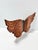A striking vintage carved wood butterfly wall sculpture featuring layered contour carving and hand-burned wood grain...