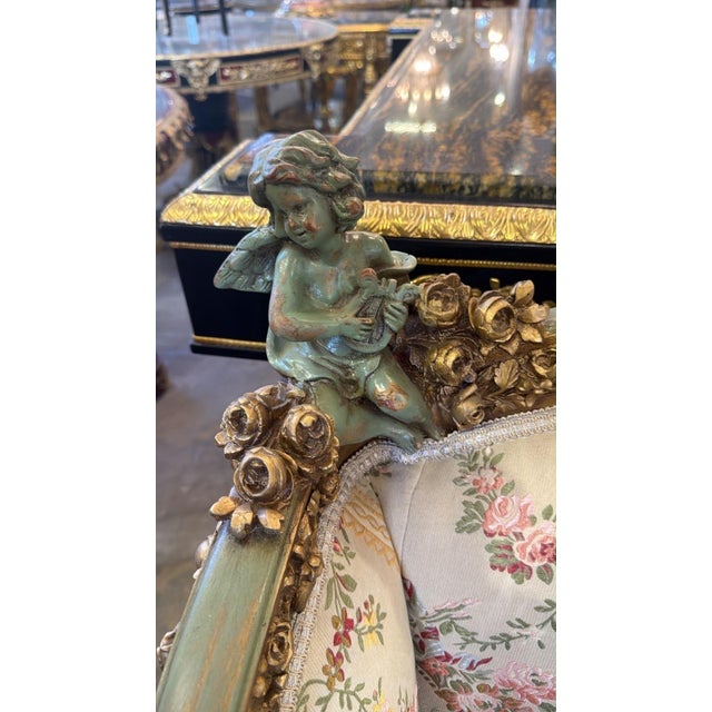 An absolutely charming French Louis XVIstyle canapé settee, beautifully upholstered in an elegant floral tapestry fabric...
