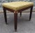 An elegant 1940s Mahogany and Upholstered Bench with Brass Capped Legs and Medallions. Dark green upholstery with minor...
