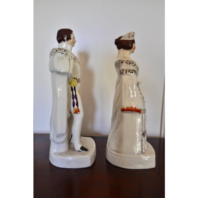 For your nearest mantle, a wondeful pair of Staffordshire figures of a young Victoria and Albert in a large size. The...