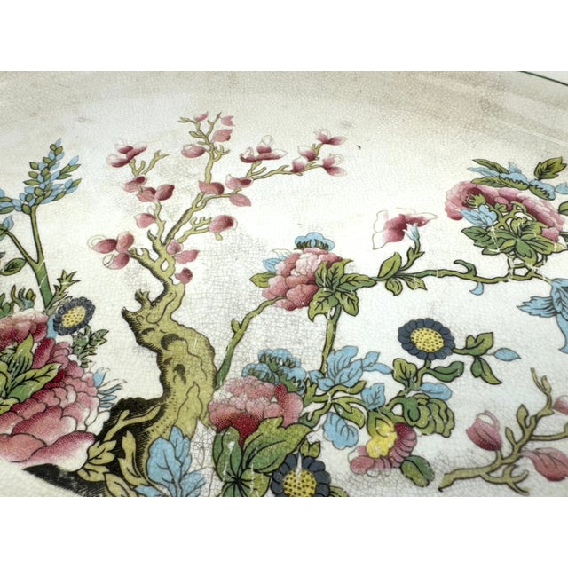 This elegant antique oval platter by Knowles, Taylor & Knowles (K.T.&K) features a beautifully intricate floral design,...