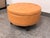 Design Plus Gallery presents a Storage Ottoman from Partner Furniture. Upholstered in light brown faux leather, the...