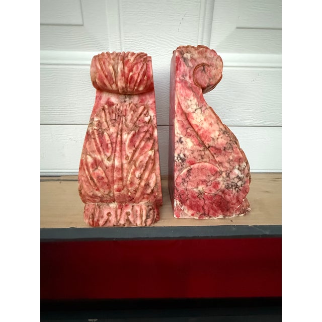 A beautiful pair of pink alabaster scroll bookends. A traditional shape with a pop of color. Each one measures 3.5” x 3.5”...