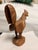 Carved from a single block of wood, this chicken has lots of detail. Look at the spurs on his legs. He is quite heavy.