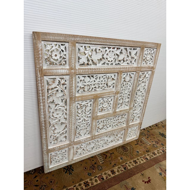 Design Plus Gallery presents a Bohemian Carved Mango Wood Wall Panel Mirror. The square composition combines openwork...