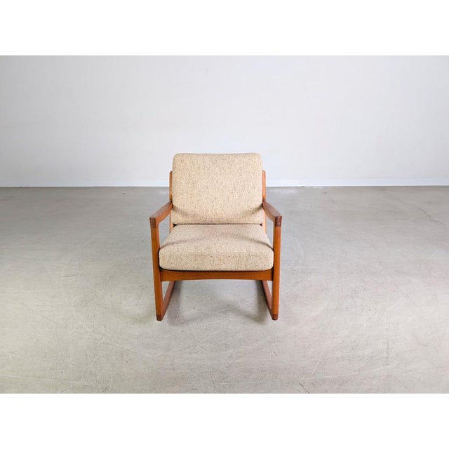We are offering a beautiful teak rocking chair by France & Son from the 1960s for sale. The model was designed by Ole...