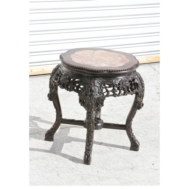 Chinese Hongmu stool or pedestal stand. Beaded Edge with marble insert top. The hongmu wood is mature and smooth to the...
