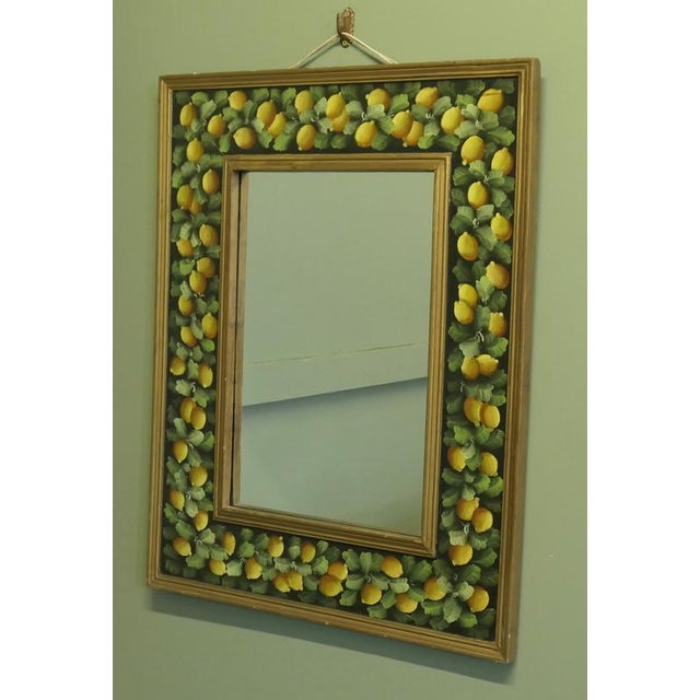 Folk Art Wall Mirror Decorated with Lemons The Mirror’s Cushion Frame is 7” wide it has a moulded edge and it is decorated...