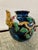Vintage majolica-style high relief bird vase with dominant colors of deep royal blue, cherry red, green, tan, and white.