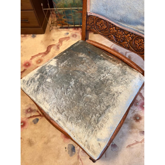 Gorgeous piece. Solid quartersawn oak featuring an original pale blue crushed velvet upholstered seat and back insert. The...
